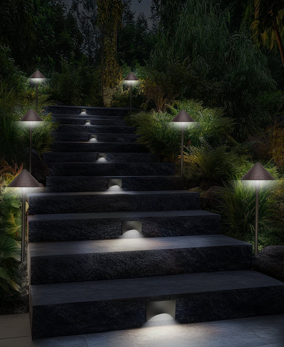 NuWatt outdoor pathway lights and step lights in a night backyard landscape